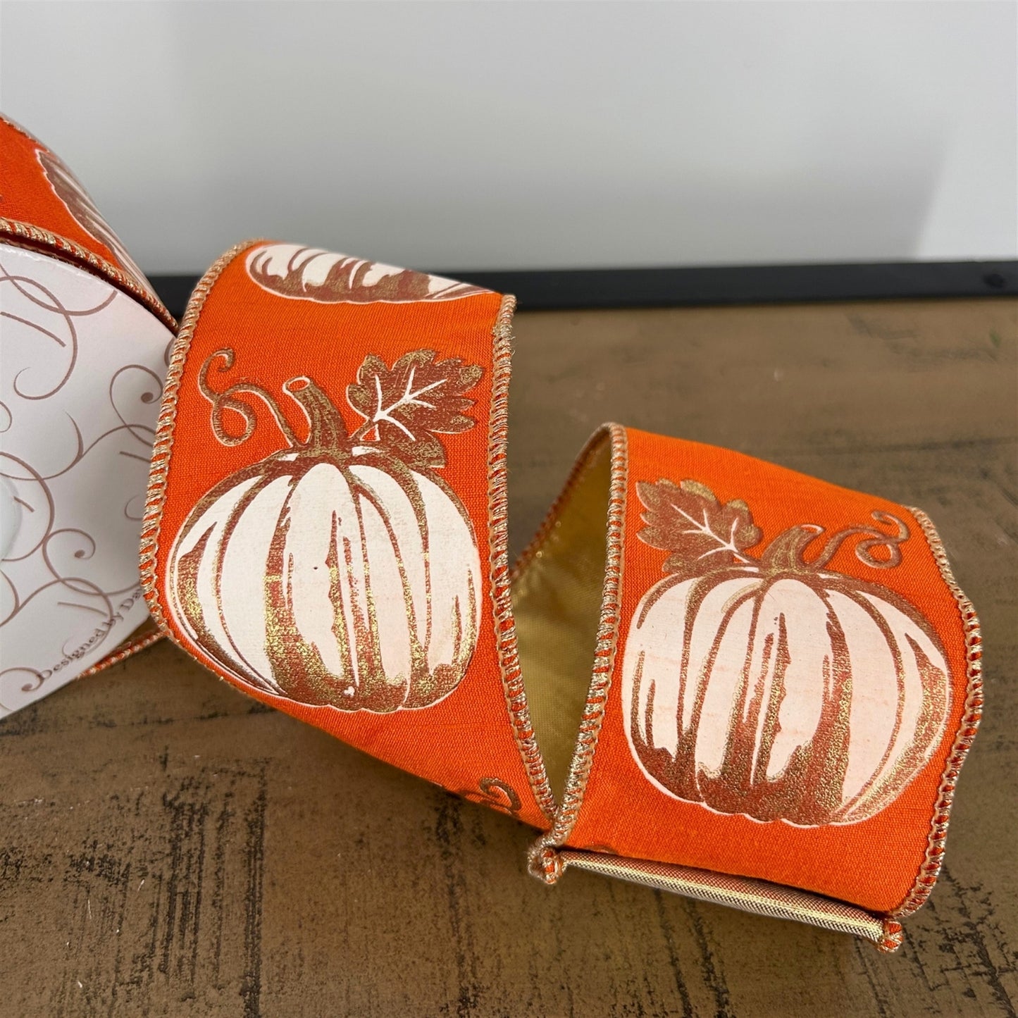 MODERN PUMPKIN PRINT ON ORANGE RIBBON W/GOLD BACK 2.5” X 10 YD